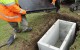 Humes Concrete Telco Pit with Lid being installed